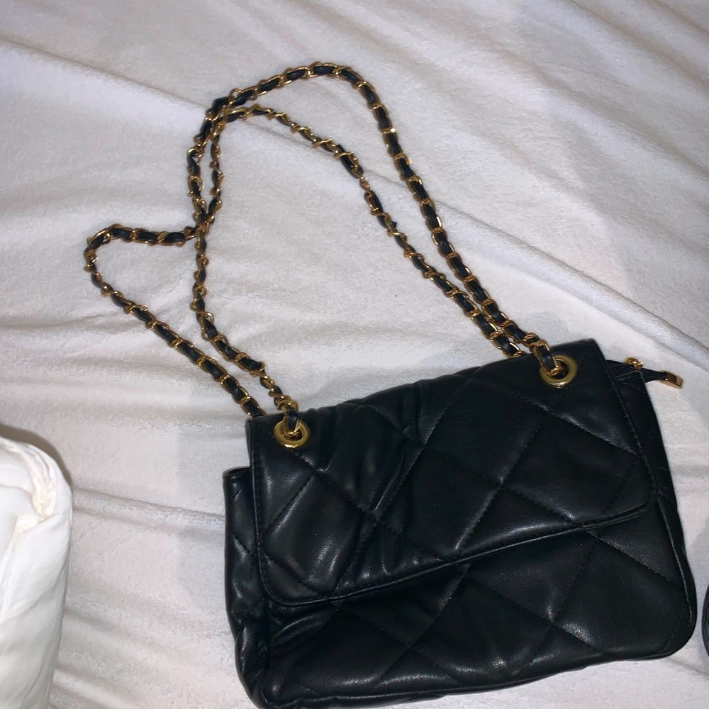 Black quilted purse with gold chain